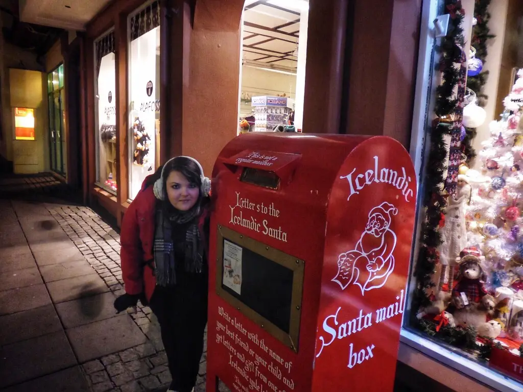 Enjoying some holiday cheer by a Santa Mail Box